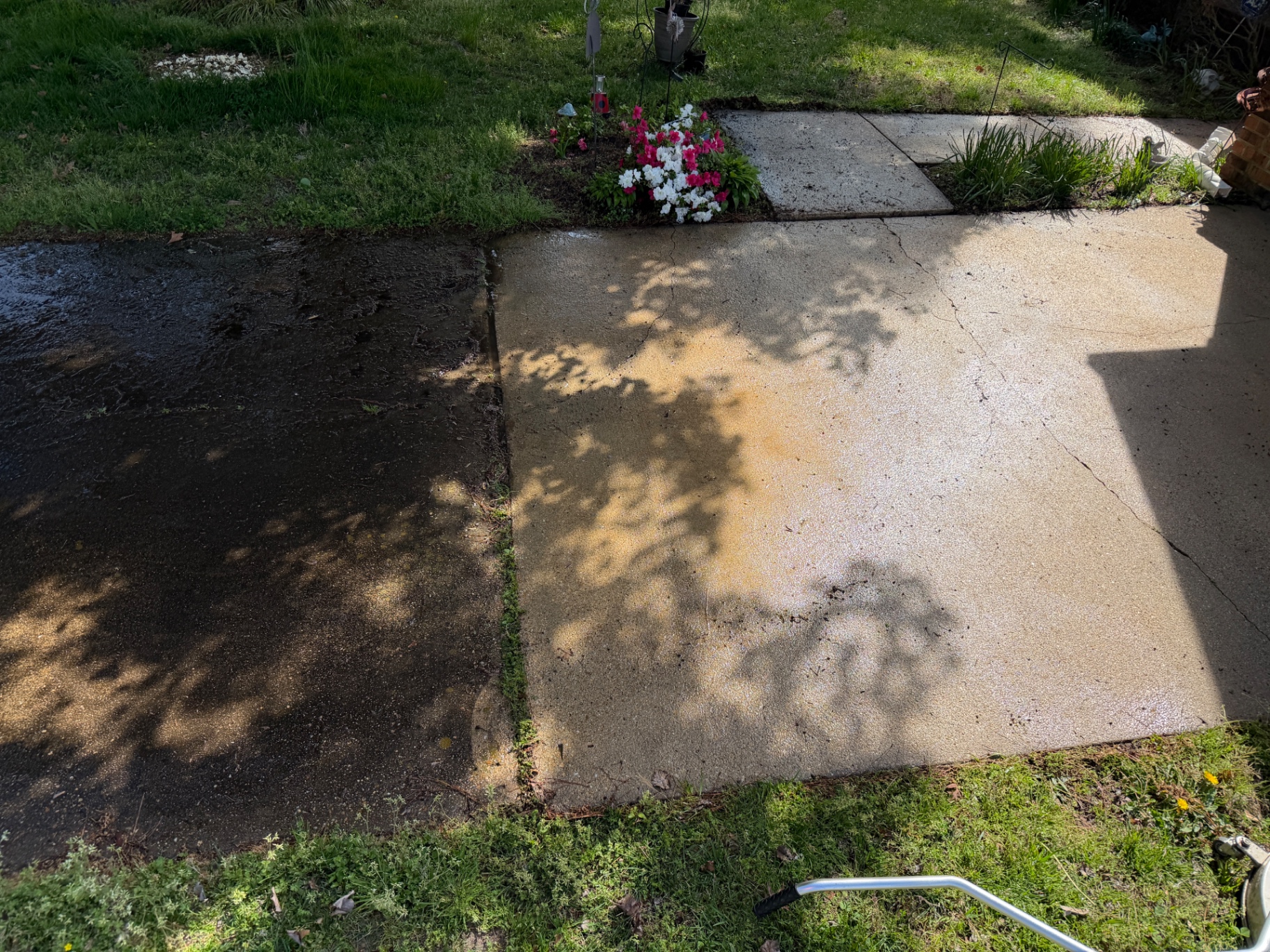 Concrete cleaned in a single pass — dirty on the left, spotless on the right